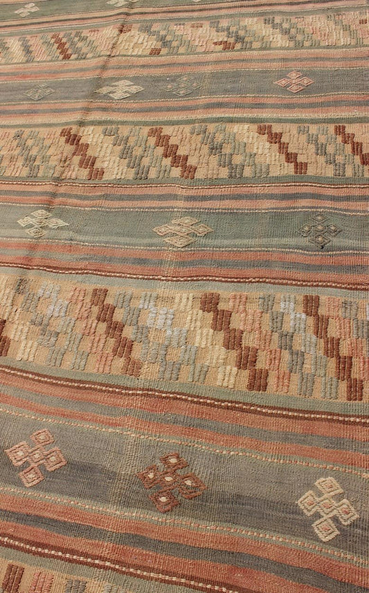 Vintage Turkish Tribal Kilim with Striped Design in Earthy Tones Measures: 5'4 x 9'8 This lovely Turkish Kilim has a striped, repeating pattern with clover motifs. The dark taupe - green stripes home the embroidered clovers, whereas the lig... - Keivan Woven ArtsTU - NED - 134 - 3562Rug
