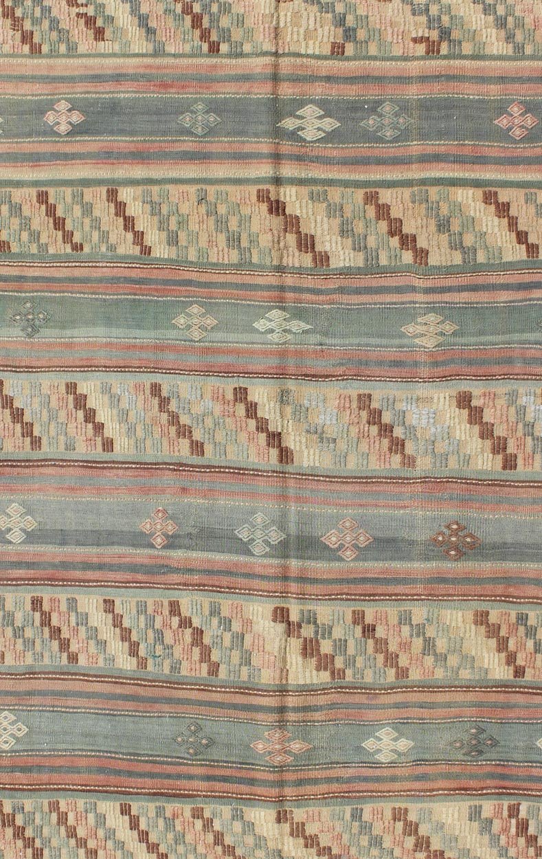 Vintage Turkish Tribal Kilim with Striped Design in Earthy Tones Measures: 5'4 x 9'8 This lovely Turkish Kilim has a striped, repeating pattern with clover motifs. The dark taupe - green stripes home the embroidered clovers, whereas the lig... - Keivan Woven ArtsTU - NED - 134 - 3562Rug