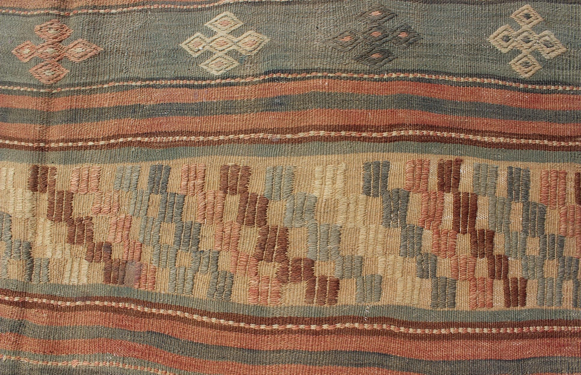 Vintage Turkish Tribal Kilim with Striped Design in Earthy Tones Measures: 5'4 x 9'8 This lovely Turkish Kilim has a striped, repeating pattern with clover motifs. The dark taupe - green stripes home the embroidered clovers, whereas the lig... - Keivan Woven ArtsTU - NED - 134 - 3562Rug