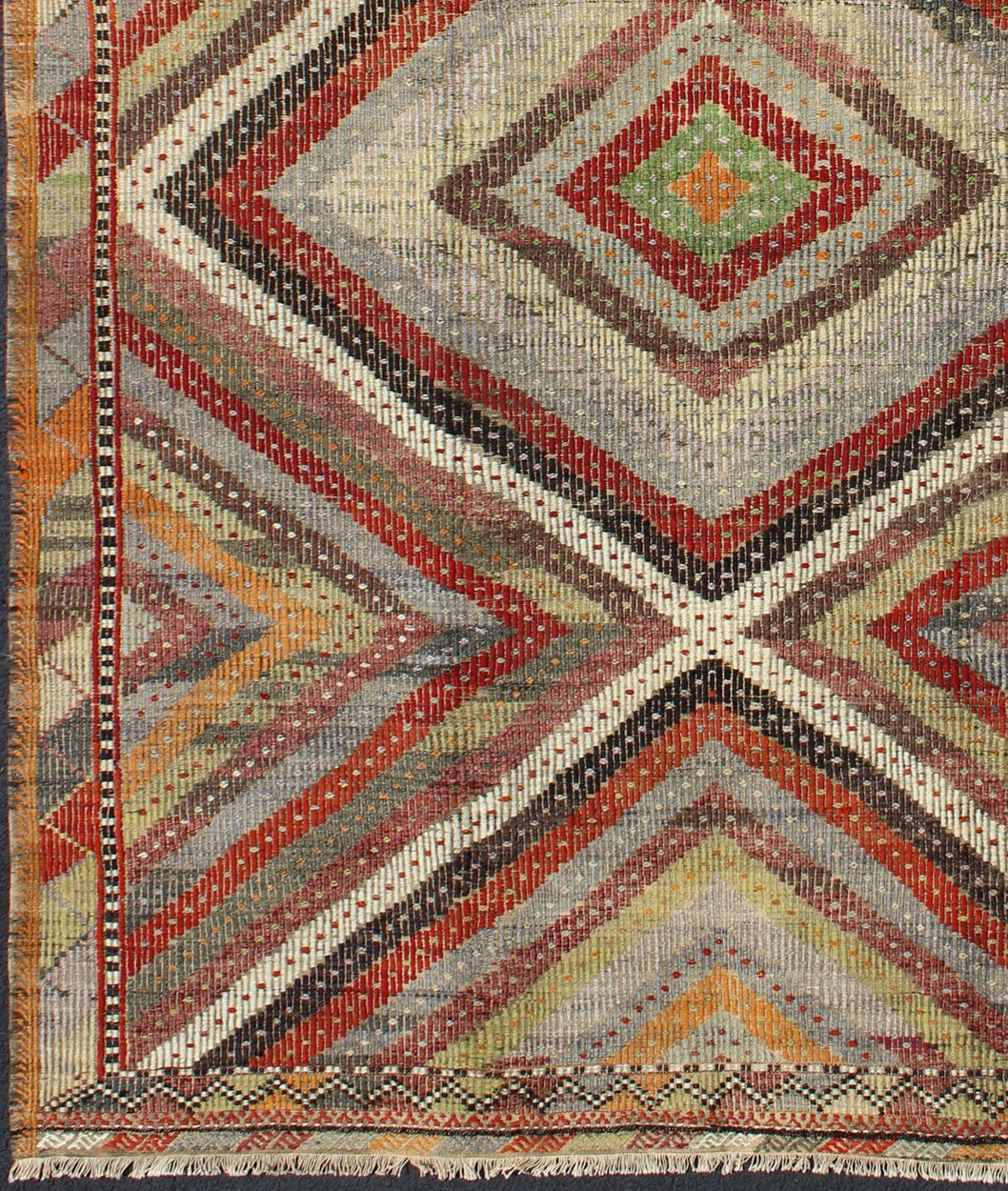 Beautiful Embroidered Turkish Jajeem - This geometric embroidered flat - weave Jajeem from Turkey bears a repeating large diamond design set on a multicolored background. The repeating design features vibrant colors of gold, light green, red, yellow, orang... - Keivan Woven ArtsTU - NED - 136031 - 4614Rug