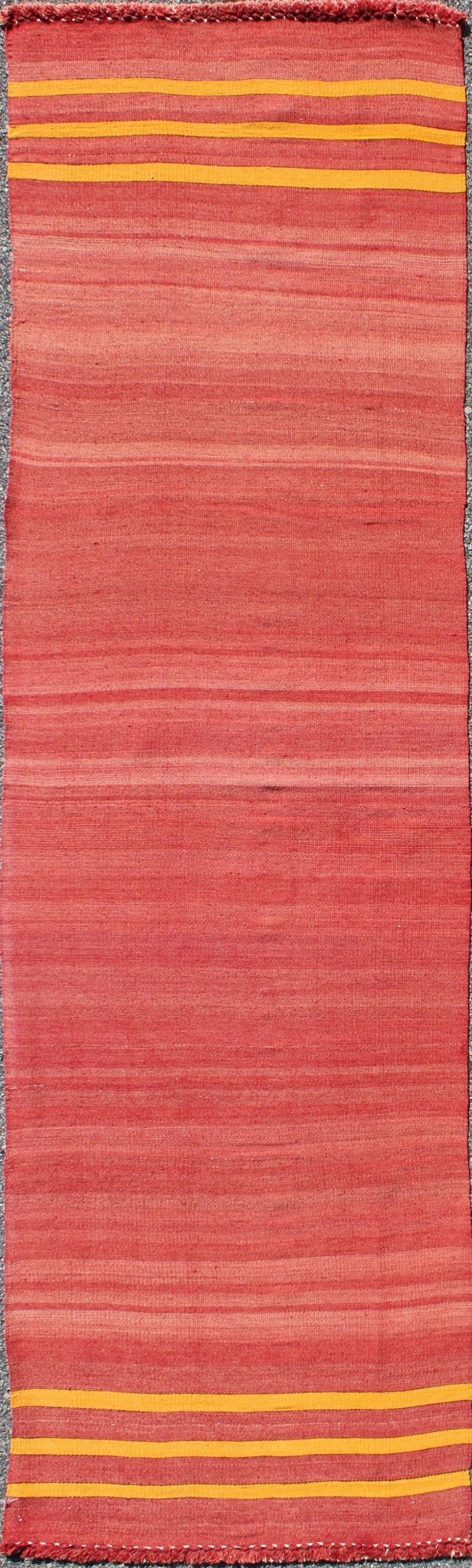 Red, yellow, and salmon pink striped midcentury vintage Turkish Kilim rug, rug ned - 143, country of origin / type: Turkey / Kilim, circa mid - 20th century Featuring a repeating horizontal stripe design, this unique midcentury Kilim rug showcases a... - Keivan Woven ArtsTU - NED - 143 - 3568Rug