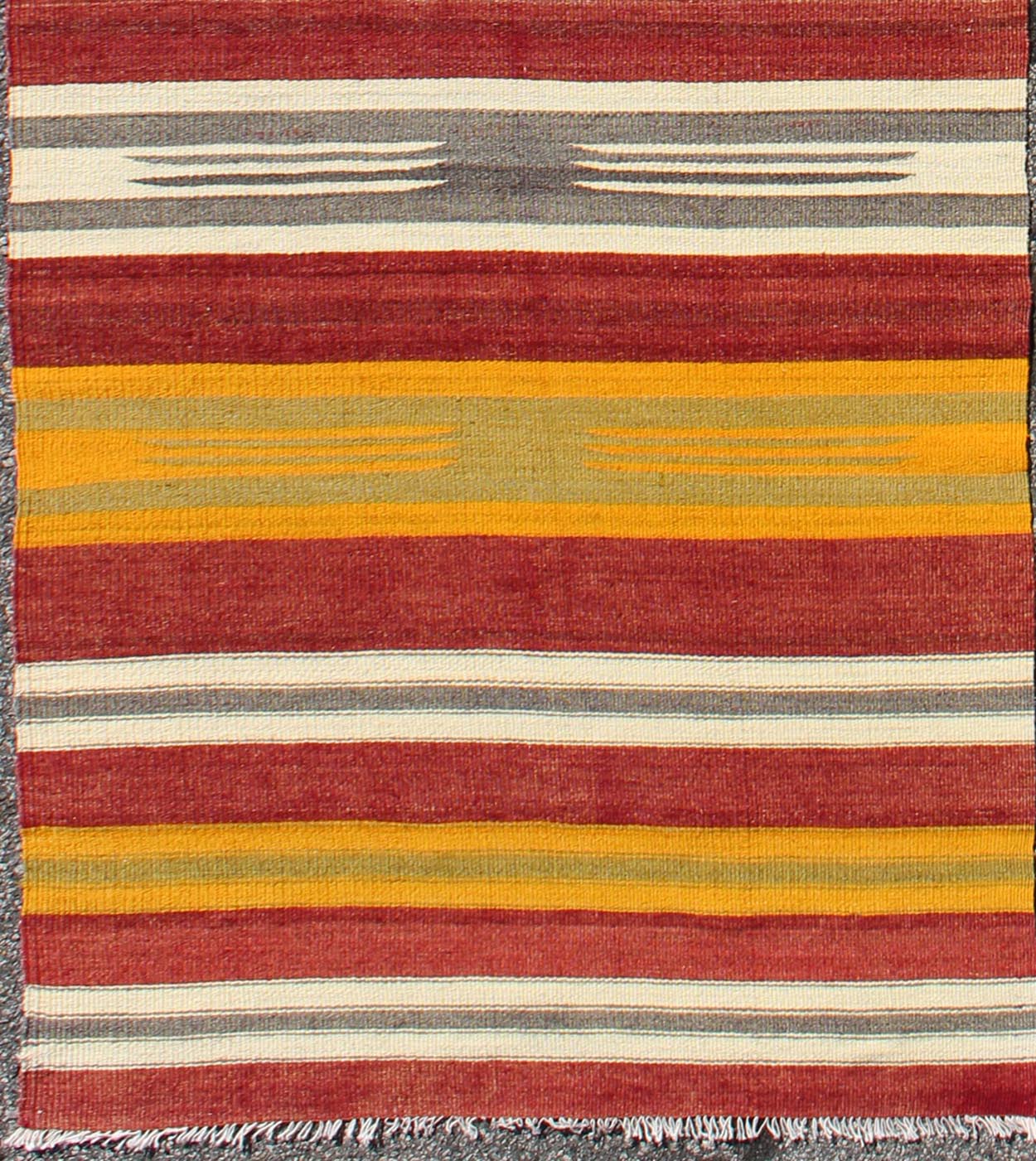 Vintage Turkish Kilim Runner with Stripes in Red, Green, Yellow, Ivory, Gray, rug ned - 145, country of origin / type: Turkey / Kilim, circa mid - 20th century. Woven during the mid - 20th century in Turkey, this designer Kilim is decorated with a hor... - Keivan Woven ArtsTU - NED - 145 - 3572Rug
