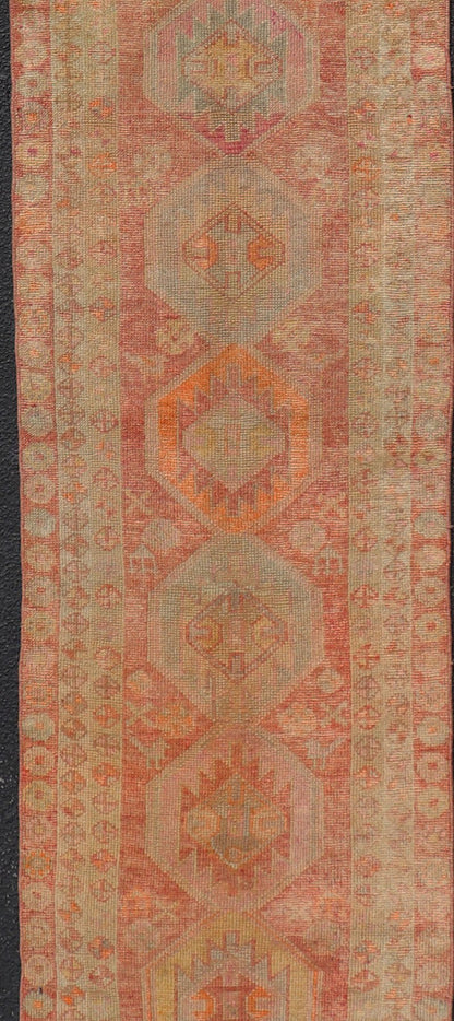 Vintage Long Turkish Oushak Runner with Tribal Medallions in Soft Red. Keivan Woven Arts / rug TU - NED - 4650, country of origin / type: Turkey / Oushak, circa 1950 Measures: 2'6 x 14'0 This vintage Turkish Oushak rug features a multi - medal... - Keivan Woven ArtsTU - NED - 4650 - 23054Rug