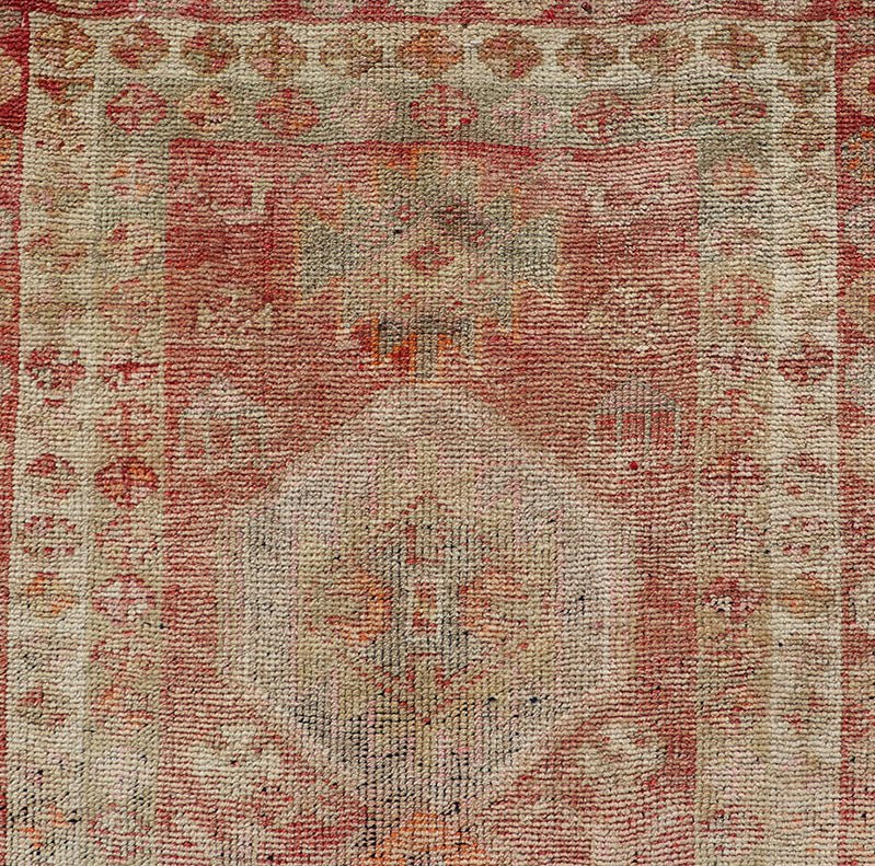 Vintage Long Turkish Oushak Runner with Tribal Medallions in Soft Red. Keivan Woven Arts / rug TU - NED - 4650, country of origin / type: Turkey / Oushak, circa 1950 Measures: 2'6 x 14'0 This vintage Turkish Oushak rug features a multi - medal... - Keivan Woven ArtsTU - NED - 4650 - 23054Rug