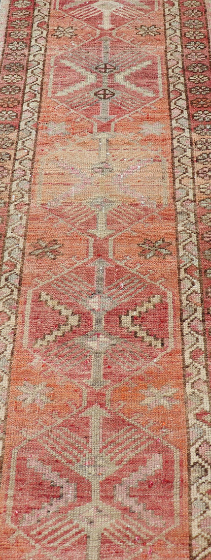 Measures: 2'10 x 14'7 Vintage Turkish Runner with Tribal Medallion Design in Variegated Red. Keivan Woven Arts / rug TU - NED - 4679, country of origin / type: Turkey / Oushak, circa 1940 This expansive runner from Turkey features a colorful pat... - Keivan Woven ArtsTU - NED - 4679 - 23060Rug