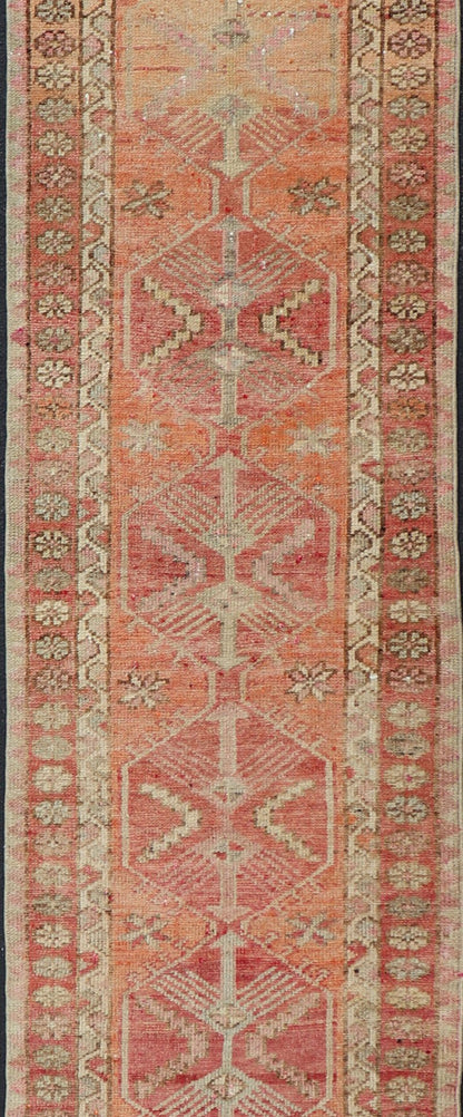 Measures: 2'10 x 14'7 Vintage Turkish Runner with Tribal Medallion Design in Variegated Red. Keivan Woven Arts / rug TU - NED - 4679, country of origin / type: Turkey / Oushak, circa 1940 This expansive runner from Turkey features a colorful pat... - Keivan Woven ArtsTU - NED - 4679 - 23060Rug