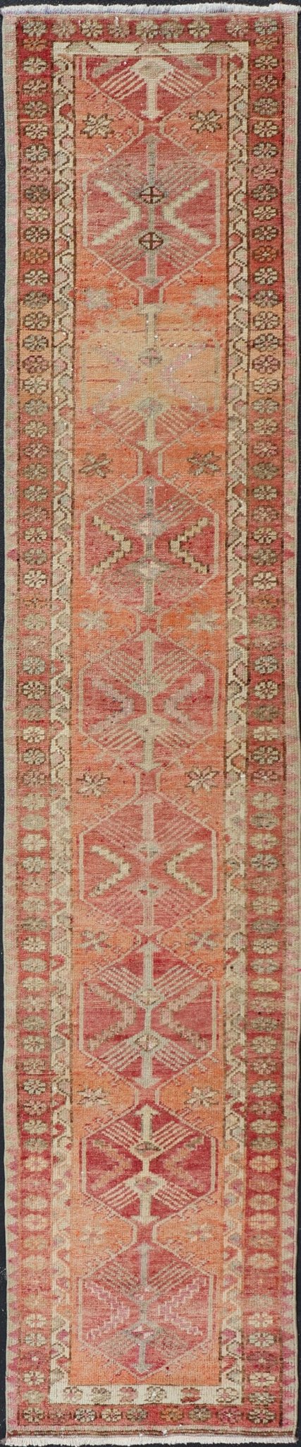 Measures: 2'10 x 14'7 Vintage Turkish Runner with Tribal Medallion Design in Variegated Red. Keivan Woven Arts / rug TU - NED - 4679, country of origin / type: Turkey / Oushak, circa 1940 This expansive runner from Turkey features a colorful pat... - Keivan Woven ArtsTU - NED - 4679 - 23060Rug