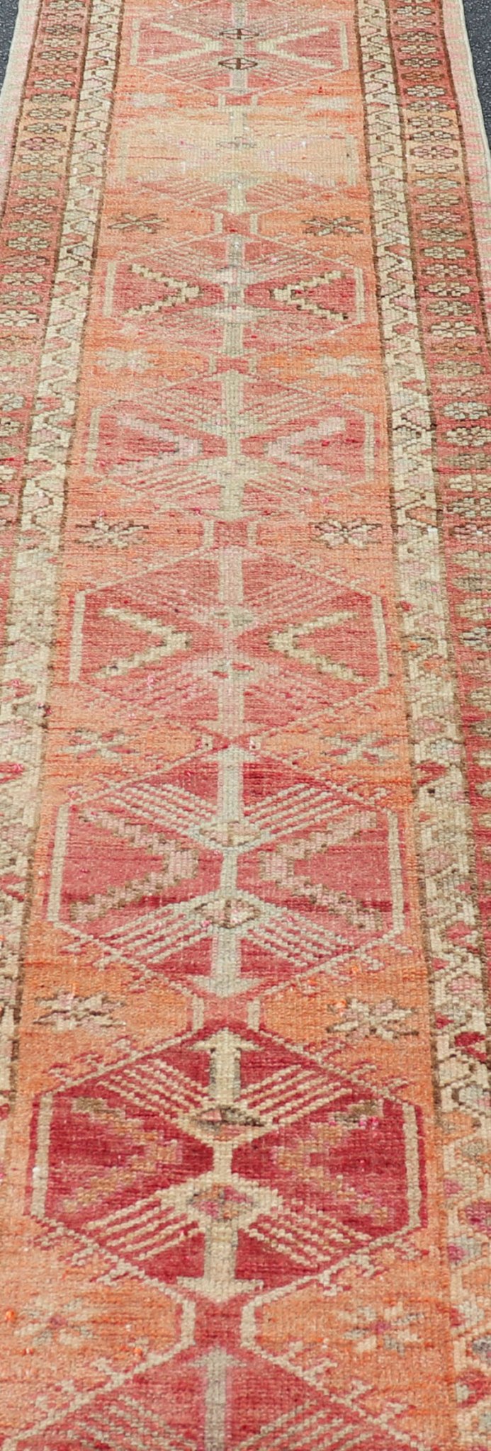 Measures: 2'10 x 14'7 Vintage Turkish Runner with Tribal Medallion Design in Variegated Red. Keivan Woven Arts / rug TU - NED - 4679, country of origin / type: Turkey / Oushak, circa 1940 This expansive runner from Turkey features a colorful pat... - Keivan Woven ArtsTU - NED - 4679 - 23060Rug