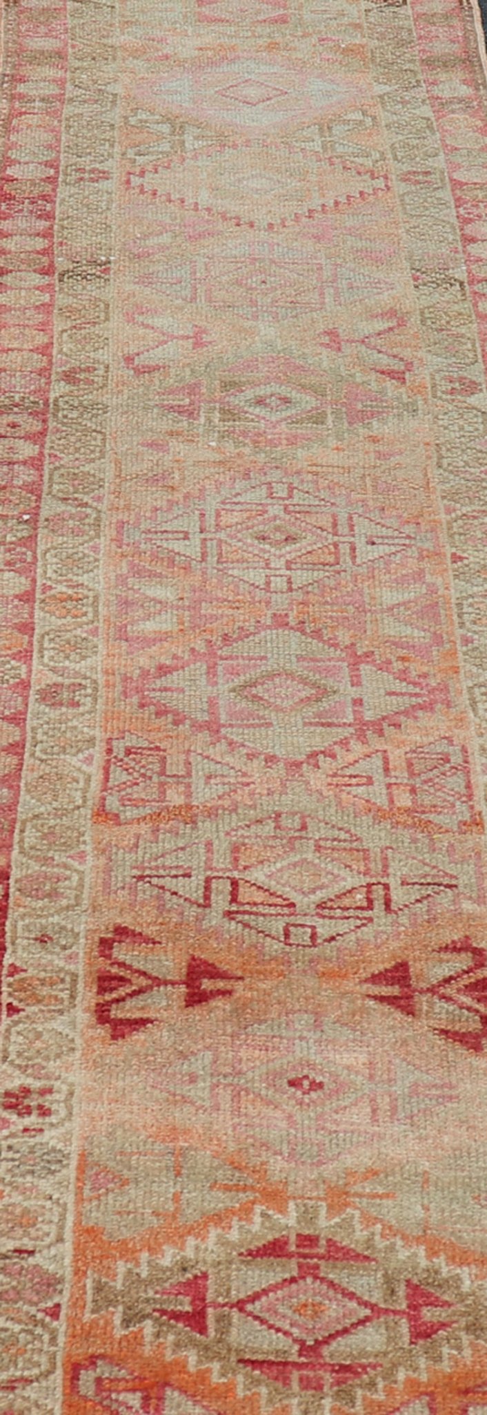 Measures: 2'8 x 14'0 Vintage Oushak Runner with Geometric Medallions in Soft Coral and Orange. Keivan Woven Arts / rug TU - NED - 4680, country of origin / type: Turkey / Oushak, circa 1960 This Oushak runner from Turkey features a creative design c... - Keivan Woven ArtsTU - NED - 4680 - 23066Rug