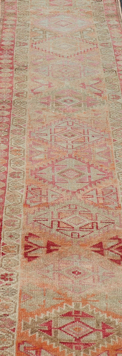 Measures: 2'8 x 14'0 Vintage Oushak Runner with Geometric Medallions in Soft Coral and Orange. Keivan Woven Arts / rug TU - NED - 4680, country of origin / type: Turkey / Oushak, circa 1960 This Oushak runner from Turkey features a creative design c... - Keivan Woven ArtsTU - NED - 4680 - 23066Rug