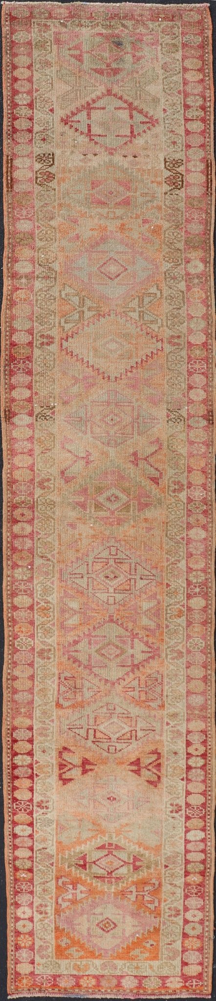 Measures: 2'8 x 14'0 Vintage Oushak Runner with Geometric Medallions in Soft Coral and Orange. Keivan Woven Arts / rug TU - NED - 4680, country of origin / type: Turkey / Oushak, circa 1960 This Oushak runner from Turkey features a creative design c... - Keivan Woven ArtsTU - NED - 4680 - 23066Rug