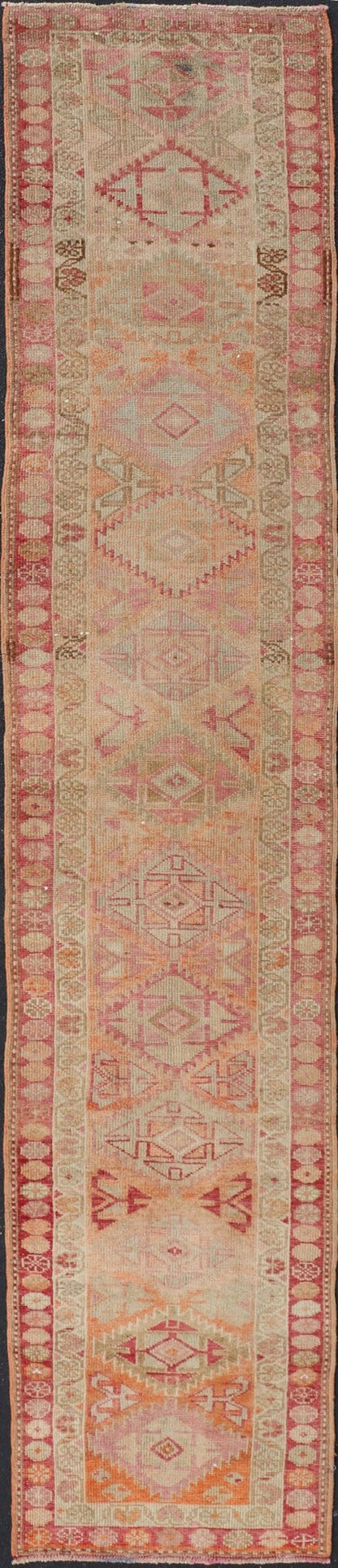 Measures: 2'8 x 14'0 Vintage Oushak Runner with Geometric Medallions in Soft Coral and Orange. Keivan Woven Arts / rug TU - NED - 4680, country of origin / type: Turkey / Oushak, circa 1960 This Oushak runner from Turkey features a creative design c... - Keivan Woven ArtsTU - NED - 4680 - 23066Rug