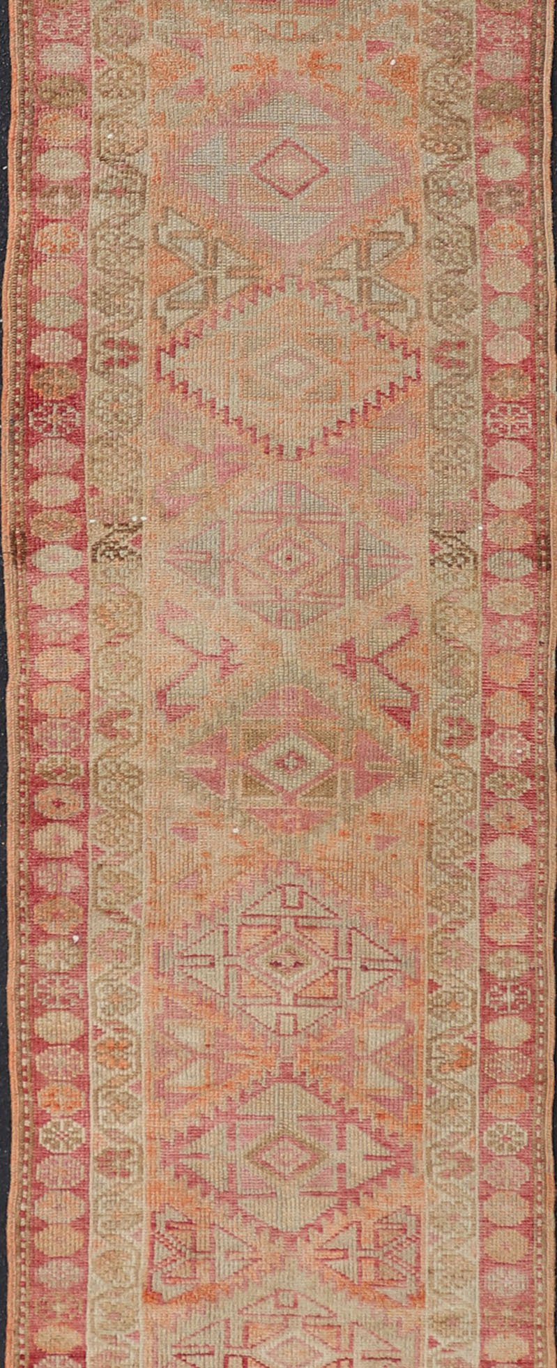 Measures: 2'8 x 14'0 Vintage Oushak Runner with Geometric Medallions in Soft Coral and Orange. Keivan Woven Arts / rug TU - NED - 4680, country of origin / type: Turkey / Oushak, circa 1960 This Oushak runner from Turkey features a creative design c... - Keivan Woven ArtsTU - NED - 4680 - 23066Rug
