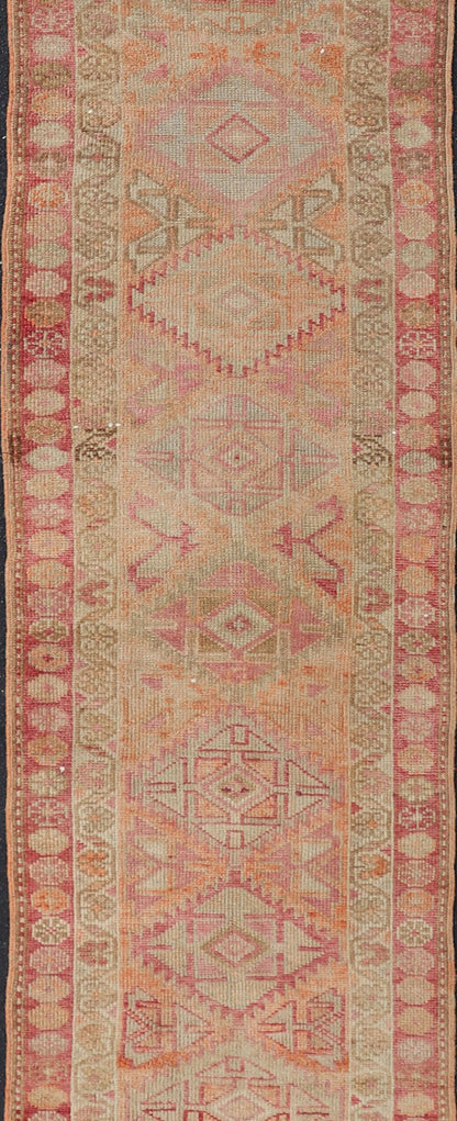 Measures: 2'8 x 14'0 Vintage Oushak Runner with Geometric Medallions in Soft Coral and Orange. Keivan Woven Arts / rug TU - NED - 4680, country of origin / type: Turkey / Oushak, circa 1960 This Oushak runner from Turkey features a creative design c... - Keivan Woven ArtsTU - NED - 4680 - 23066Rug