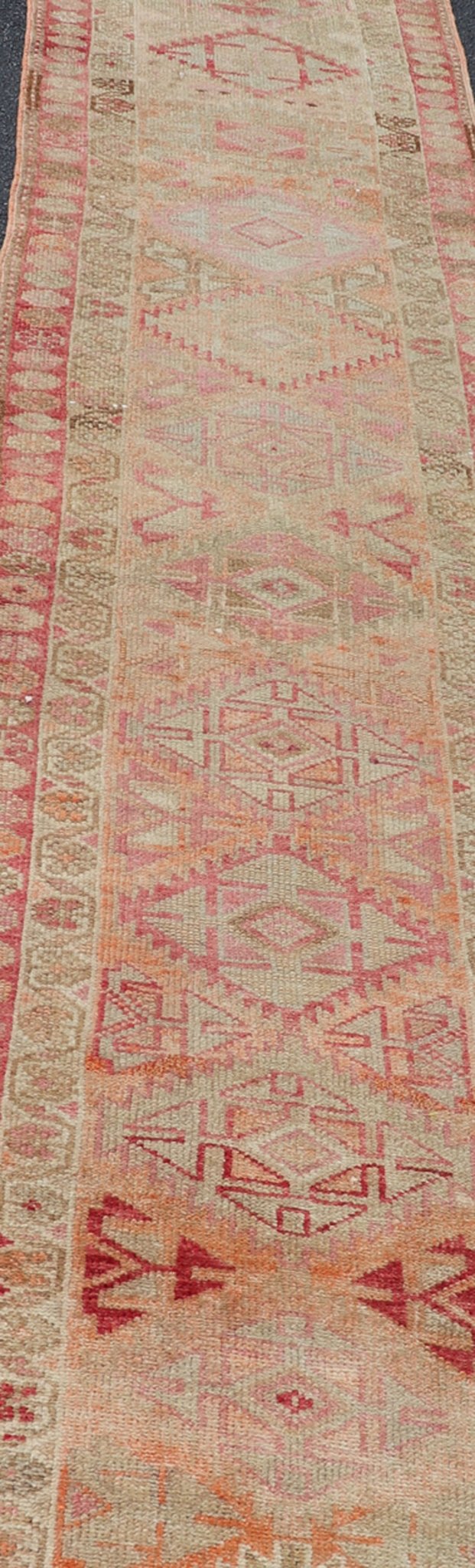 Measures: 2'8 x 14'0 Vintage Oushak Runner with Geometric Medallions in Soft Coral and Orange. Keivan Woven Arts / rug TU - NED - 4680, country of origin / type: Turkey / Oushak, circa 1960 This Oushak runner from Turkey features a creative design c... - Keivan Woven ArtsTU - NED - 4680 - 23066Rug