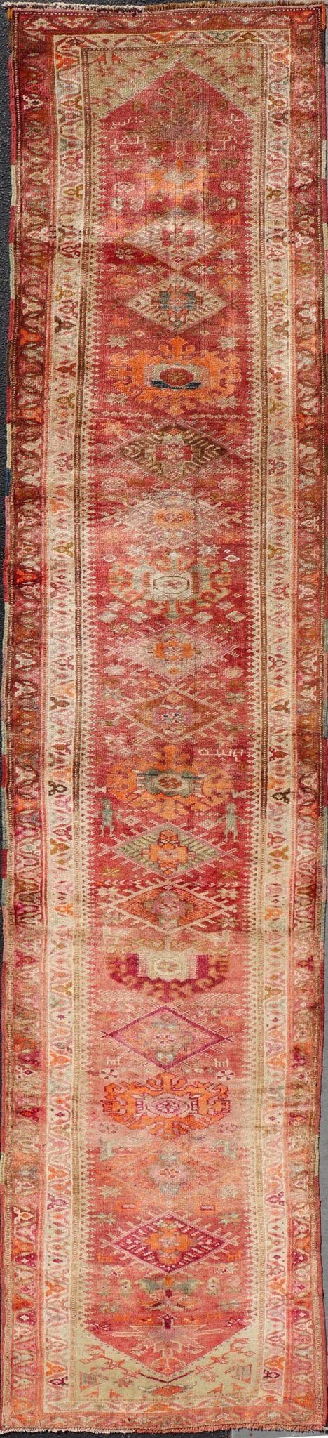 Measures: 3'0 x 15'8 Vintage Turkish Oushak Runner with Geometric Medallion Design in Muted Coral. Keivan Woven Arts / rug TU - NED - 4682, country of origin / type: Turkey / Oushak, circa 1960 This beautiful vintage Oushak runner from 1960s Turkey ... - Keivan Woven ArtsTU - NED - 4682 - 21379Rug