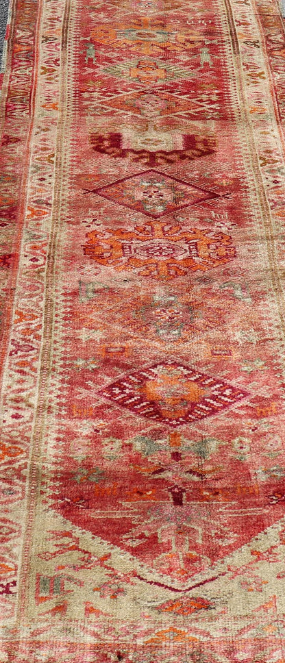Measures: 3'0 x 15'8 Vintage Turkish Oushak Runner with Geometric Medallion Design in Muted Coral. Keivan Woven Arts / rug TU - NED - 4682, country of origin / type: Turkey / Oushak, circa 1960 This beautiful vintage Oushak runner from 1960s Turkey ... - Keivan Woven ArtsTU - NED - 4682 - 21379Rug