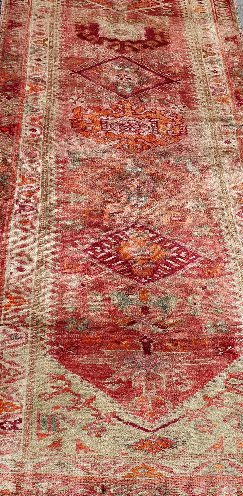 Measures: 3'0 x 15'8 Vintage Turkish Oushak Runner with Geometric Medallion Design in Muted Coral. Keivan Woven Arts / rug TU - NED - 4682, country of origin / type: Turkey / Oushak, circa 1960 This beautiful vintage Oushak runner from 1960s Turkey ... - Keivan Woven ArtsTU - NED - 4682 - 21379Rug