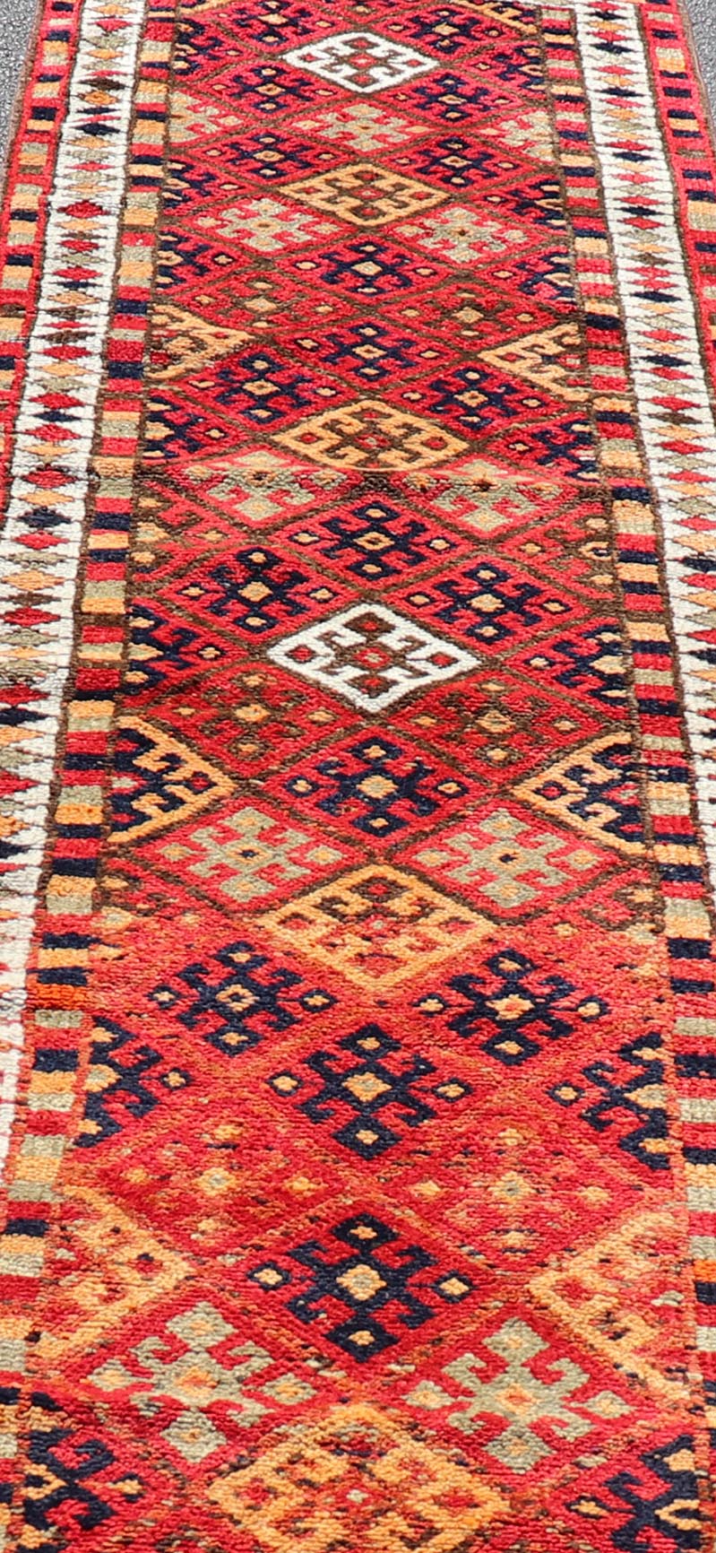 Measures: 2'10 x 14'0 Vintage Turkish Oushak Runner with Medallions in Red and Multi Colors. Keivan Woven Arts / rug TU - NED - 4686, country of origin / type: Turkey / Oushak, circa mid - 20th Century. This Oushak runner from mid - 20th century Turkey ... - Keivan Woven ArtsTU - NED - 4686 - 22099Rug
