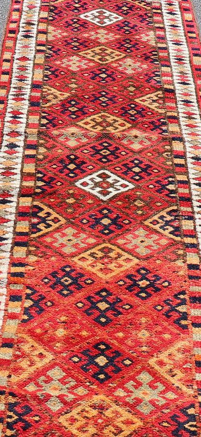 Measures: 2'10 x 14'0 Vintage Turkish Oushak Runner with Medallions in Red and Multi Colors. Keivan Woven Arts / rug TU - NED - 4686, country of origin / type: Turkey / Oushak, circa mid - 20th Century. This Oushak runner from mid - 20th century Turkey ... - Keivan Woven ArtsTU - NED - 4686 - 22099Rug