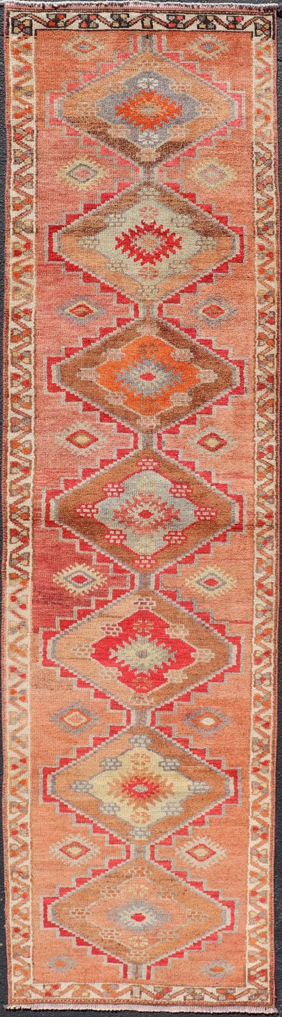 Measures: 2'10 x 11'10 Vintage Turkish Oushak Runner with Tribal Medallions in Redish Tones. Keivan Woven Arts / rug TU - NED - 4688, country of origin / type: Turkey / Oushak, circa 1950. This vintage Oushak runner features a unique blend of cheerfu... - Keivan Woven ArtsTU - NED - 4688 - 22111Rug