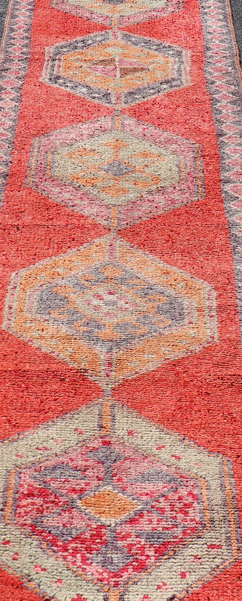 Colorful Oushak Vintage Turkish Runner with Geometric Medallion Design With Orangey - Red Measures: 3'0 x 11'9 Oushak Vintage Turkish Runner with Geometric Medallion Design With Orangey - Red. Keivan Woven Arts / rug TU - NED - 4694, country of or... - Keivan Woven ArtsTU - NED - 4694 - 22141Rug