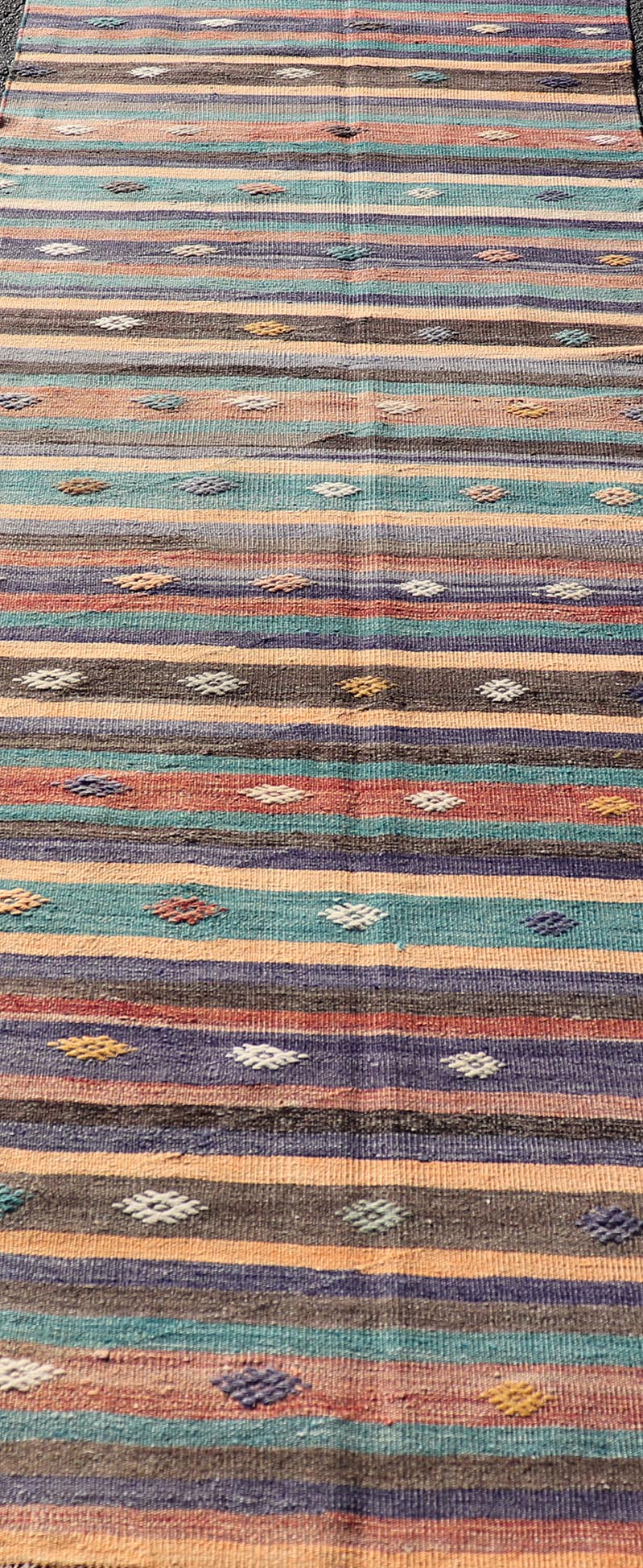 Measures: 3'3 x 10'10 Colorful Vintage Embroidered Kilim Runner with Stripe's and Geometric. Keivan Woven Arts / rug TU - NED - 5003, country of origin / type: Turkey / Kilim, circa 1950 This vintage Kilim displays an array of designs, including... - Keivan Woven ArtsTU - NED - 5003 - 22183Rug