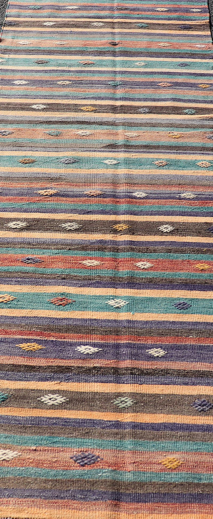 Measures: 3'3 x 10'10 Colorful Vintage Embroidered Kilim Runner with Stripe's and Geometric. Keivan Woven Arts / rug TU - NED - 5003, country of origin / type: Turkey / Kilim, circa 1950 This vintage Kilim displays an array of designs, including... - Keivan Woven ArtsTU - NED - 5003 - 22183Rug