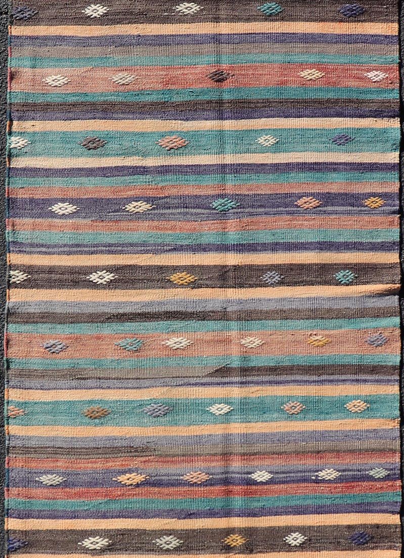 Measures: 3'3 x 10'10 Colorful Vintage Embroidered Kilim Runner with Stripe's and Geometric. Keivan Woven Arts / rug TU - NED - 5003, country of origin / type: Turkey / Kilim, circa 1950 This vintage Kilim displays an array of designs, including... - Keivan Woven ArtsTU - NED - 5003 - 22183Rug