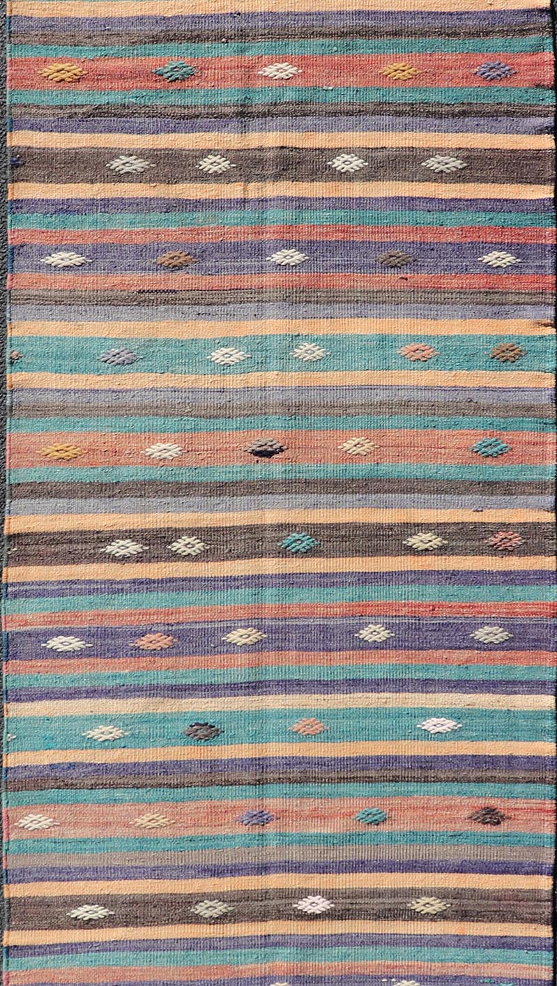 Measures: 3'3 x 10'10 Colorful Vintage Embroidered Kilim Runner with Stripe's and Geometric. Keivan Woven Arts / rug TU - NED - 5004, country of origin / type: Turkey / Kilim, circa 1950 This vintage Kilim displays an array of designs, including... - Keivan Woven ArtsTU - NED - 5004 - 22189Rug