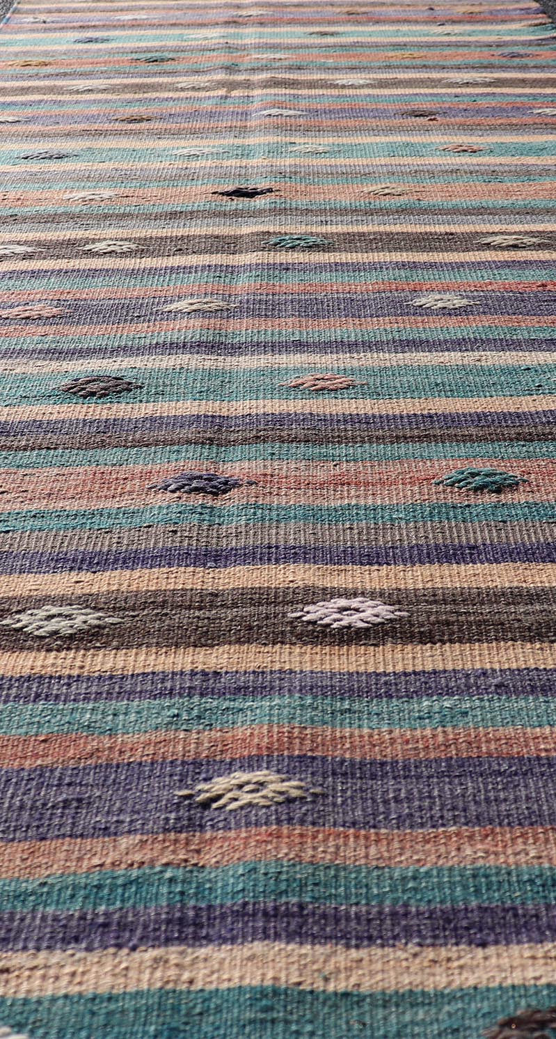 Measures: 3'3 x 10'10 Colorful Vintage Embroidered Kilim Runner with Stripe's and Geometric. Keivan Woven Arts / rug TU - NED - 5004, country of origin / type: Turkey / Kilim, circa 1950 This vintage Kilim displays an array of designs, including... - Keivan Woven ArtsTU - NED - 5004 - 22189Rug