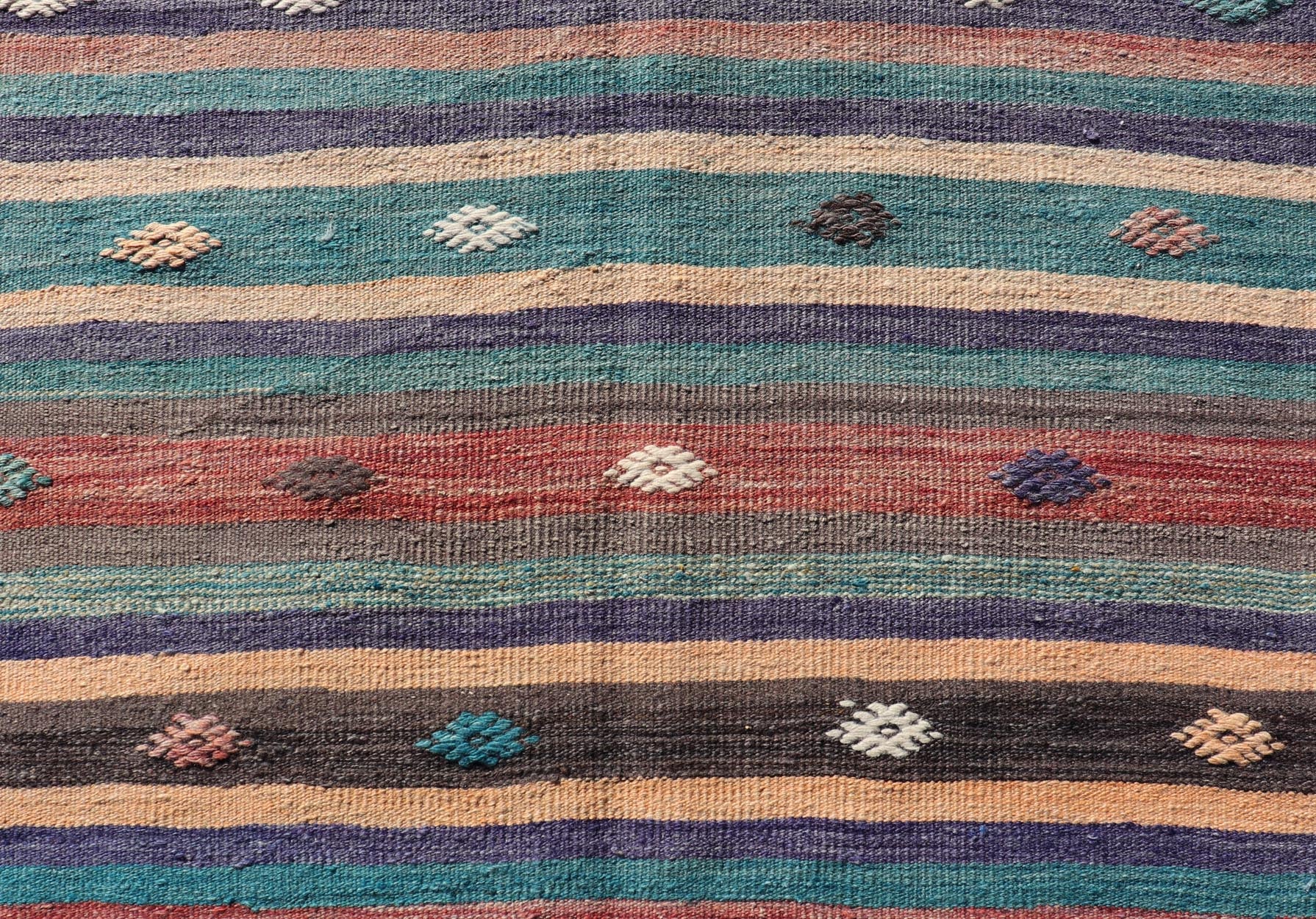 Measures: 3'3 x 10'10 Colorful Vintage Embroidered Kilim Runner with Stripe's and Geometric. Keivan Woven Arts / rug TU - NED - 5004, country of origin / type: Turkey / Kilim, circa 1950 This vintage Kilim displays an array of designs, including... - Keivan Woven ArtsTU - NED - 5004 - 22189Rug