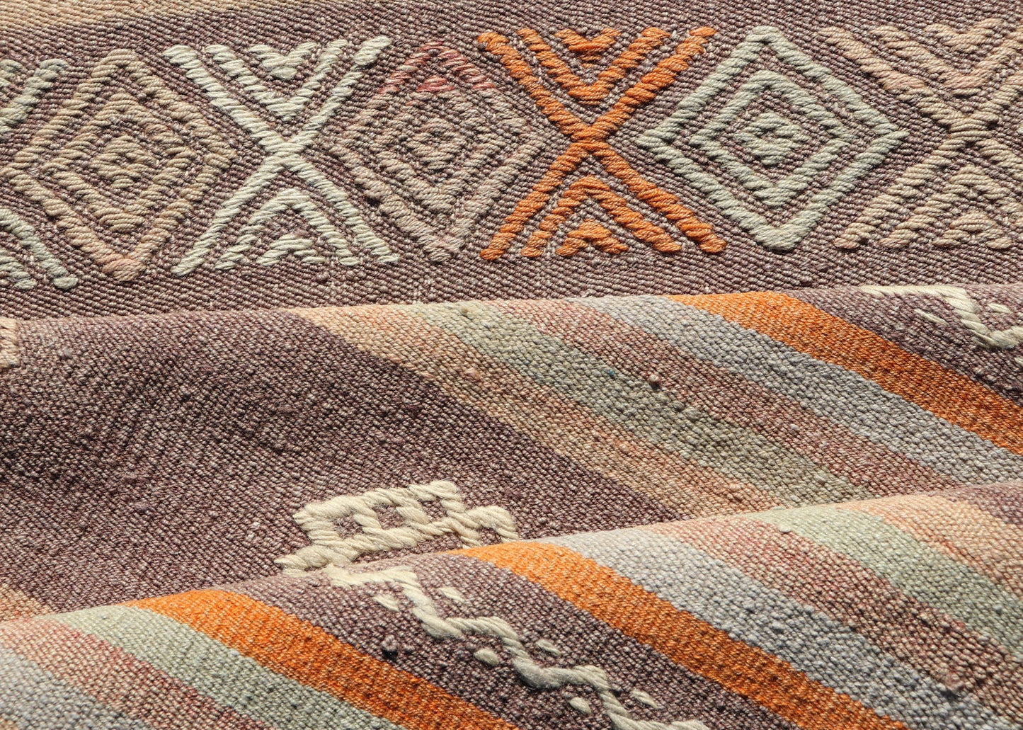 Measures: 3'4 x 11'3 Turkish Vintage Flat - Weave Kilim in Muted Colors with Stripes and Embroideries. Keivan Woven Arts: rug TU - NED - 5011 / mid 20th century Turkey. This charming vintage flat weave Kilim was hand woven in Turkey during the 195... - Keivan Woven ArtsTU - NED - 5011 - 23006Rug