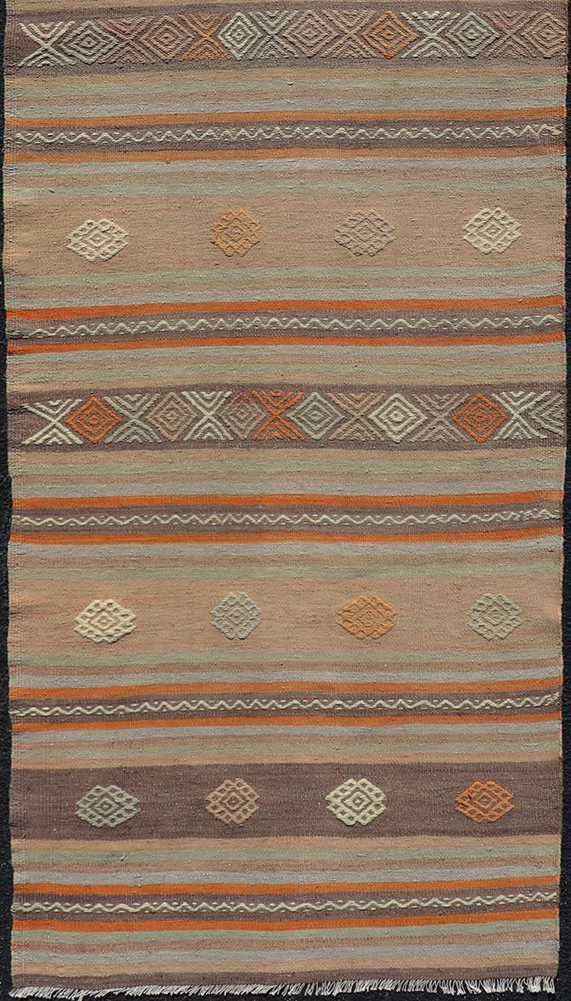 Measures: 3'4 x 11'3 Turkish Vintage Flat - Weave Kilim in Muted Colors with Stripes and Embroideries. Keivan Woven Arts: rug TU - NED - 5011 / mid 20th century Turkey. This charming vintage flat weave Kilim was hand woven in Turkey during the 195... - Keivan Woven ArtsTU - NED - 5011 - 23006Rug