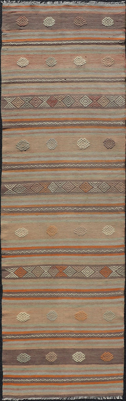 Measures: 3'4 x 11'3 Turkish Vintage Flat - Weave Kilim in Muted Colors with Stripes and Embroideries. Keivan Woven Arts: rug TU - NED - 5011 / mid 20th century Turkey. This charming vintage flat weave Kilim was hand woven in Turkey during the 195... - Keivan Woven ArtsTU - NED - 5011 - 23006Rug
