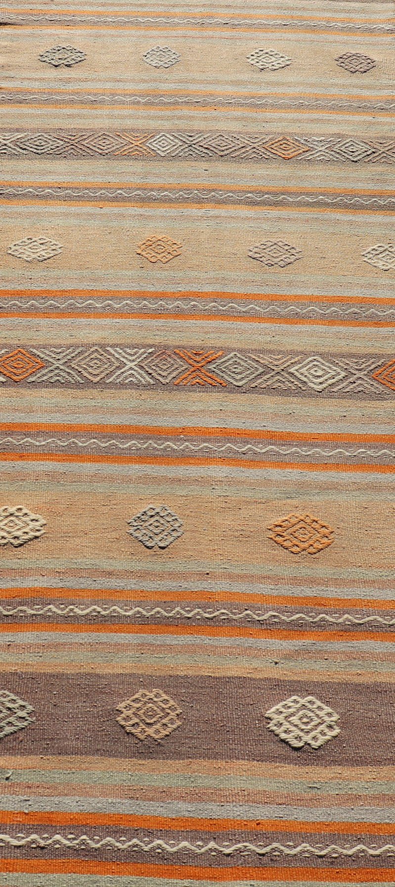 Measures: 3'4 x 11'3 Turkish Vintage Flat - Weave Kilim in Muted Colors with Stripes and Embroideries. Keivan Woven Arts: rug TU - NED - 5011 / mid 20th century Turkey. This charming vintage flat weave Kilim was hand woven in Turkey during the 195... - Keivan Woven ArtsTU - NED - 5011 - 23006Rug