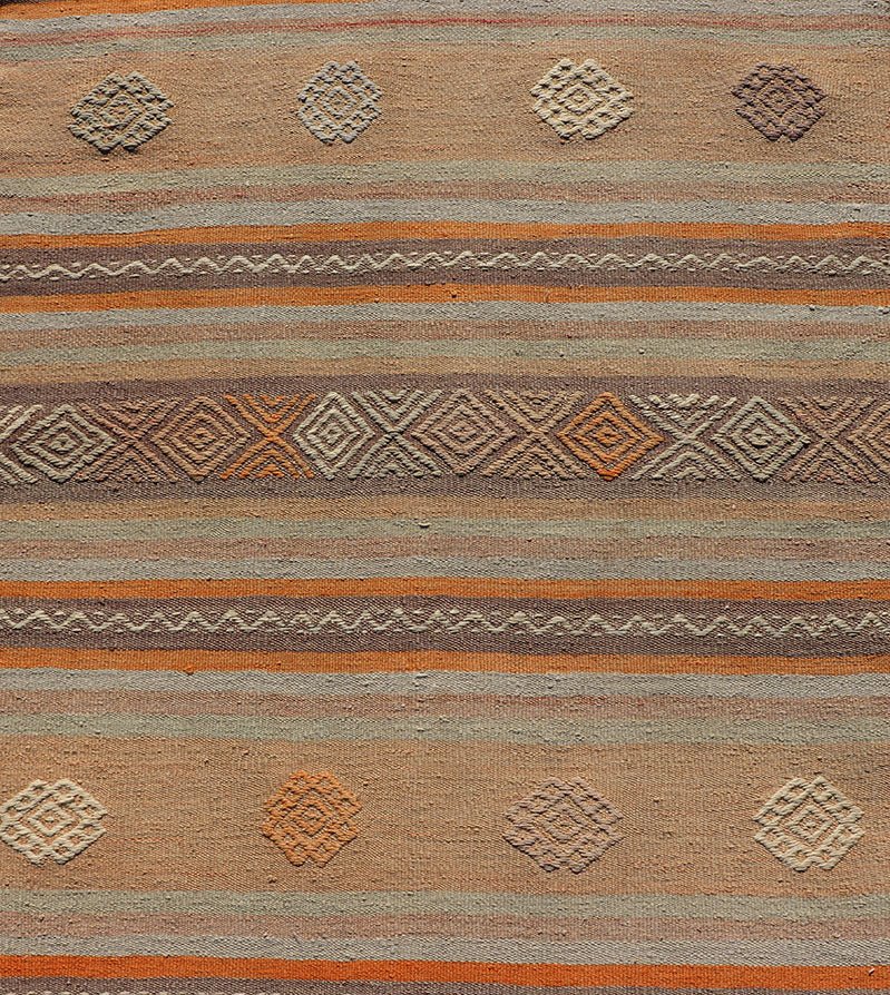 Measures: 3'4 x 11'3 Turkish Vintage Flat - Weave Kilim in Muted Colors with Stripes and Embroideries. Keivan Woven Arts: rug TU - NED - 5011 / mid 20th century Turkey. This charming vintage flat weave Kilim was hand woven in Turkey during the 195... - Keivan Woven ArtsTU - NED - 5011 - 23006Rug