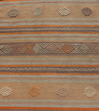 Measures: 3'4 x 11'3 Turkish Vintage Flat - Weave Kilim in Muted Colors with Stripes and Embroideries. Keivan Woven Arts: rug TU - NED - 5011 / mid 20th century Turkey. This charming vintage flat weave Kilim was hand woven in Turkey during the 195... - Keivan Woven ArtsTU - NED - 5011 - 23006Rug