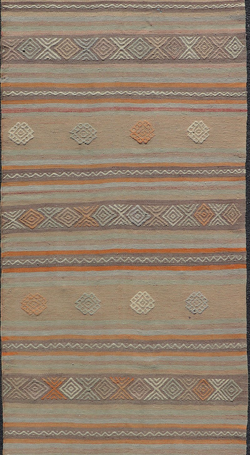 Measures: 3'4 x 11'0 Vintage Turkish Flat - Weave Kilim in Muted Colors with Stripes and Embroideries. Keivan Woven Arts: rug TU - NED - 5012 / mid 20th century Turkey. This charming vintage flat weave Kilim was hand woven in Turkey during the 19... - Keivan Woven ArtsTU - NED - 5012 - 23012Rug