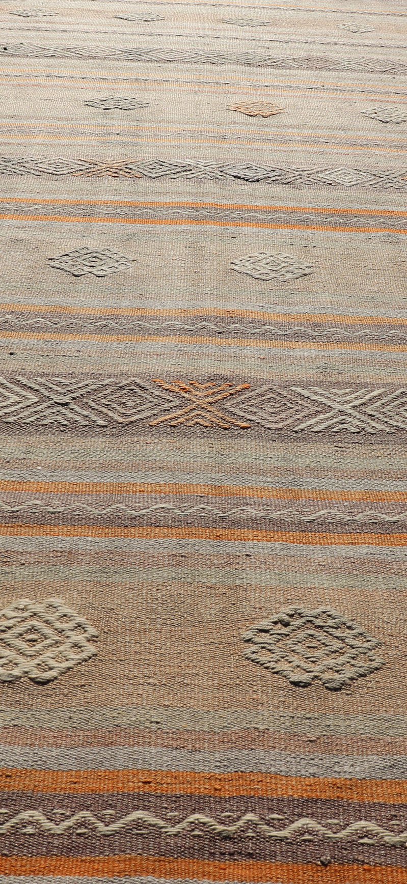 Measures: 3'4 x 11'0 Vintage Turkish Flat - Weave Kilim in Muted Colors with Stripes and Embroideries. Keivan Woven Arts: rug TU - NED - 5012 / mid 20th century Turkey. This charming vintage flat weave Kilim was hand woven in Turkey during the 19... - Keivan Woven ArtsTU - NED - 5012 - 23012Rug