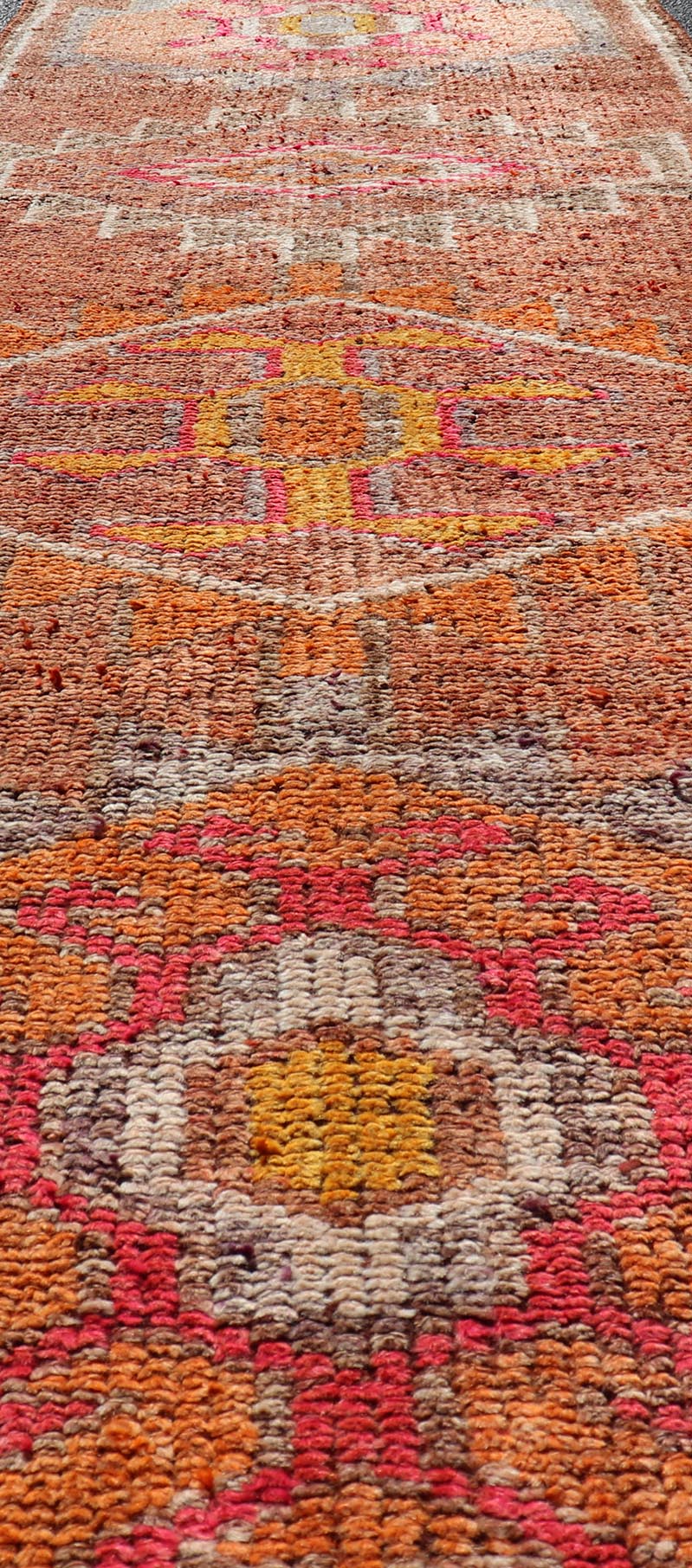 Measures: 2'9 x 11'0 Vintage Turkish Runner with Large Medallion Kurdish Design in Earthy Tones. Keivan Woven Arts / rug TU - NED - 5021, country of origin / type: Turkey / Oushak, circa 1960. This beautiful vintage Oushak runner from 1960s Turkey f... - Keivan Woven ArtsTU - NED - 5021 - 22267Rug