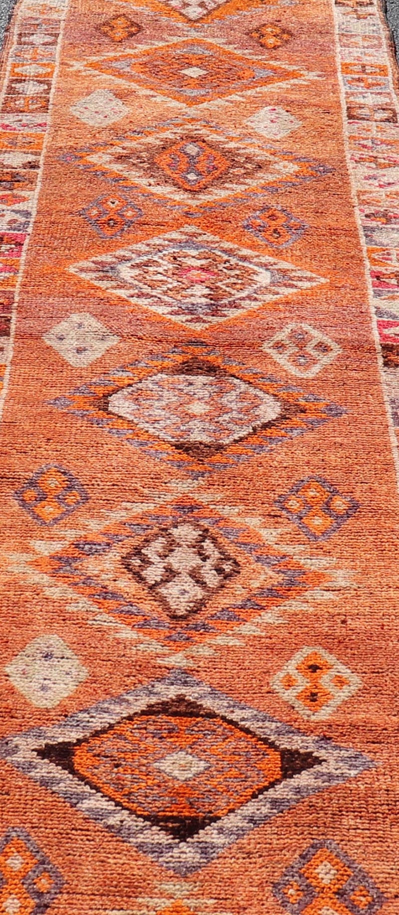 Measures: 3'0 x 14'2 Multicolored Midcentury Turkish Kurdish Oushak Runner with Diamond Medallions. Keivan Woven Arts / rug TU - NED - 5022, country of origin / type: Iran / Kurdish Oushak, circa 1950 This Kurdish tribal rug was woven with the empha... - Keivan Woven ArtsTU - NED - 5022 - 22273Rug
