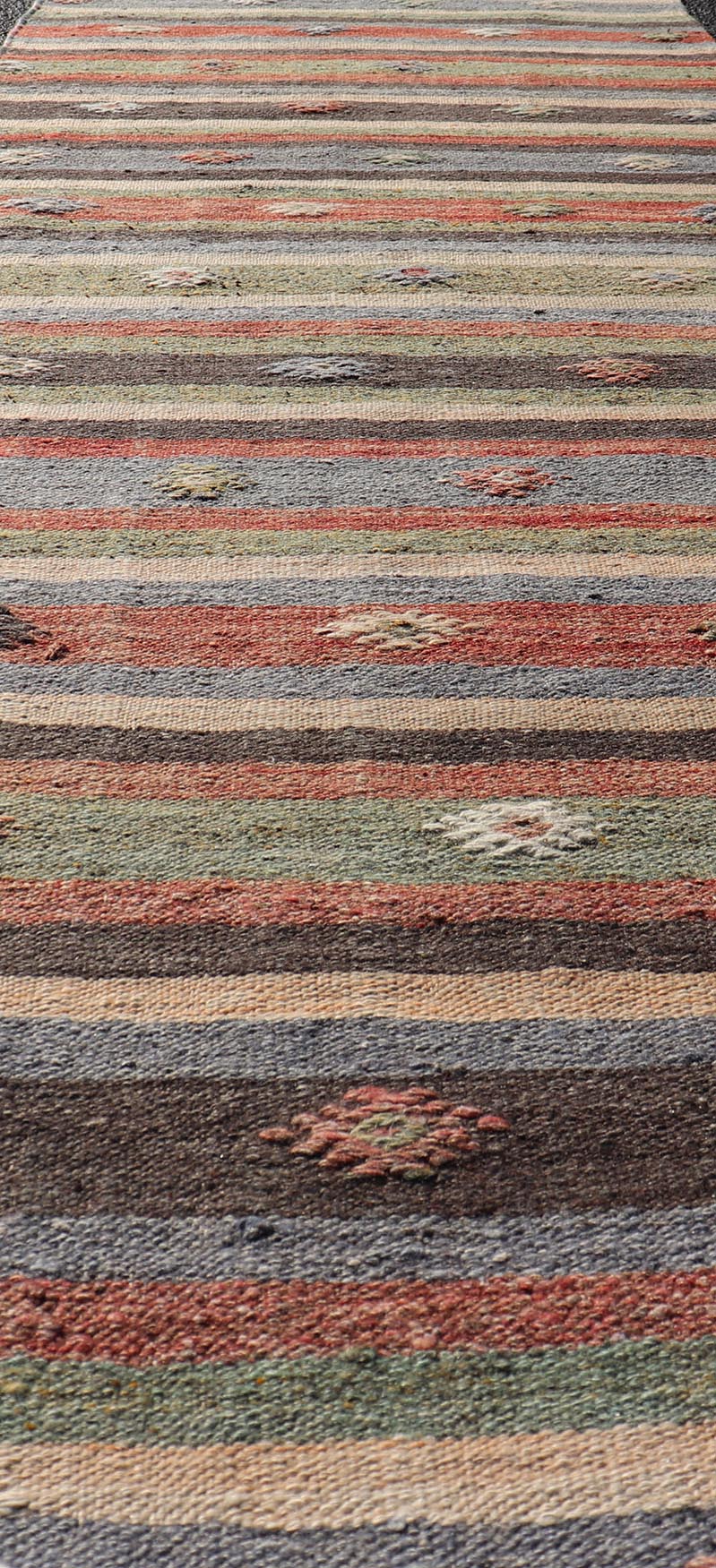 Measures: 2'8 x 10'8 Turkish Vintage Kilim Striped Runner with Tribal Motifs in Copper and Greens. Keivan Woven Arts / rug TU - NED - 5024, country of origin / type: Turkey / Kilim, circa 1950 This vintage flat - woven Kilim runner features a minimali... - Keivan Woven ArtsTU - NED - 5024 - 22285Rug