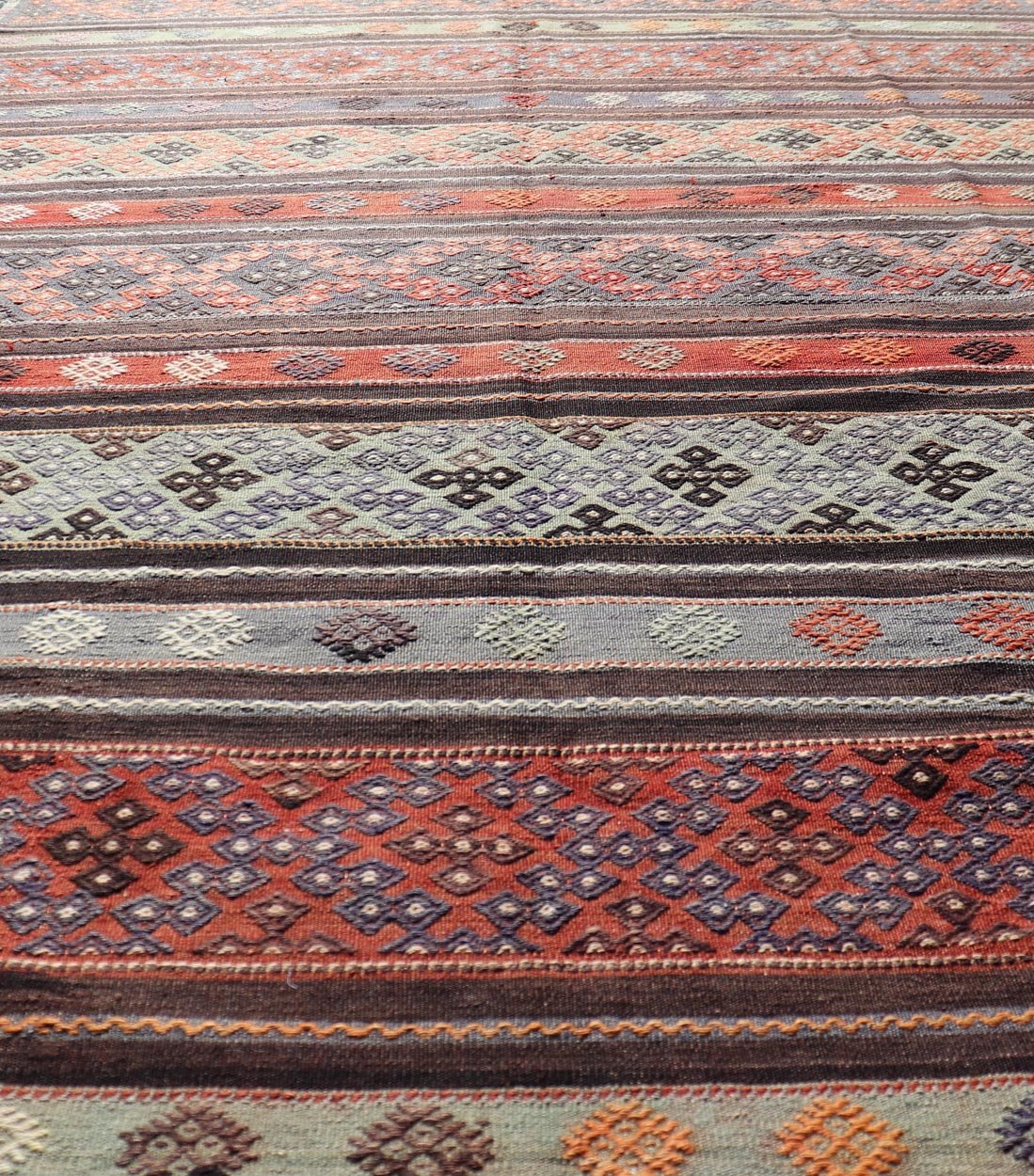 Measures: 6'0 x 10'8 Vintage Turkish Embroidered Large Gallery Kilim Rug with Stripe Design. Keivan Woven Arts / rug TU - NED - 5027, country of origin / type: Turkey / Kilim, circa Mid - 20th Century. Woven during the mid - 20th century in Turkey, this... - Keivan Woven ArtsTU - NED - 5027 - 22303Rug