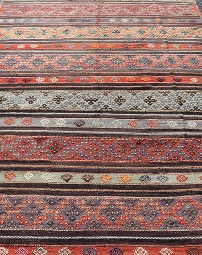 Measures: 6'0 x 10'8 Vintage Turkish Embroidered Large Gallery Kilim Rug with Stripe Design. Keivan Woven Arts / rug TU - NED - 5027, country of origin / type: Turkey / Kilim, circa Mid - 20th Century. Woven during the mid - 20th century in Turkey, this... - Keivan Woven ArtsTU - NED - 5027 - 22303Rug