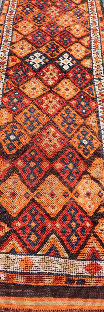 Measures: 3'0 x 11'5 Vintage Turkish Runner with All - Over Diamond Tribal Design in Multi - Colors. Keivan Woven Arts / TU - NED - 5029, country of origin / type: Turkey / Oushak, circa 1960. This beautiful vintage Oushak runner from 1960s features... - Keivan Woven ArtsTU - NED - 5029 - 22315Rug