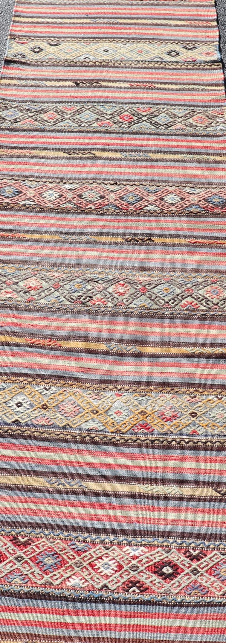 Turkish Vintage Kilim with Horizontal Stripes and Tribal Motifs Measures: 2'5 x 9'4 Turkish Vintage Kilim with Horizontal Stripes and Tribal Motifs. Keivan Woven Arts / rug TU - NED - 5046, country of origin / type: Turkey / Kilim, circa Mid - 20th C... - Keivan Woven ArtsTU - NED - 5046 - 22363Rug