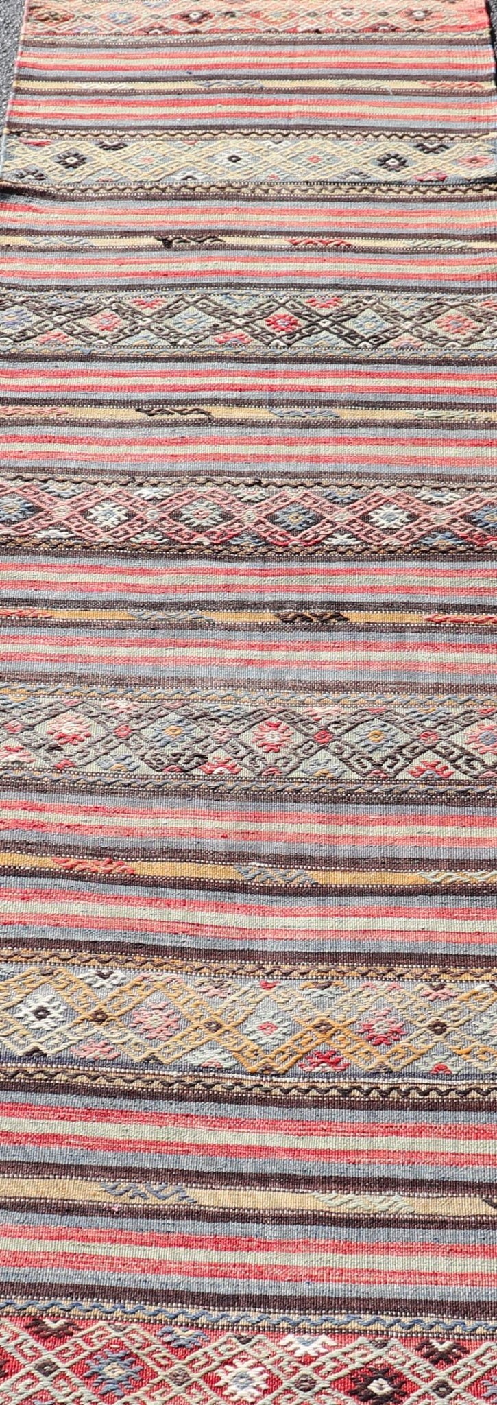 Turkish Vintage Kilim with Horizontal Stripes and Tribal Motifs Measures: 2'5 x 9'4 Turkish Vintage Kilim with Horizontal Stripes and Tribal Motifs. Keivan Woven Arts / rug TU - NED - 5046, country of origin / type: Turkey / Kilim, circa Mid - 20th C... - Keivan Woven ArtsTU - NED - 5046 - 22363Rug