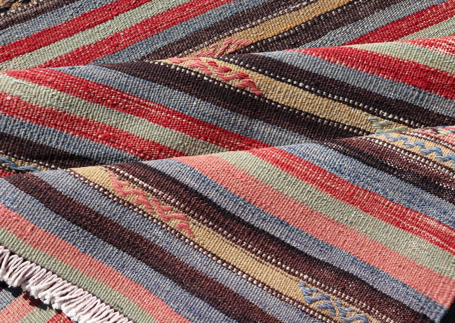 Vintage Turkish Kilim with Horizontal Stripes and Tribal Motifs in Bright Tones. Hand Woven vintage Turkish Kilim in colors with hand woven motifs with stripes, Keivan Woven Arts / rug TU - NED - 5047, country of origin / type: Turkey / Kilim, circ... - Keivan Woven ArtsTU - NED - 5047 - 22369Rug