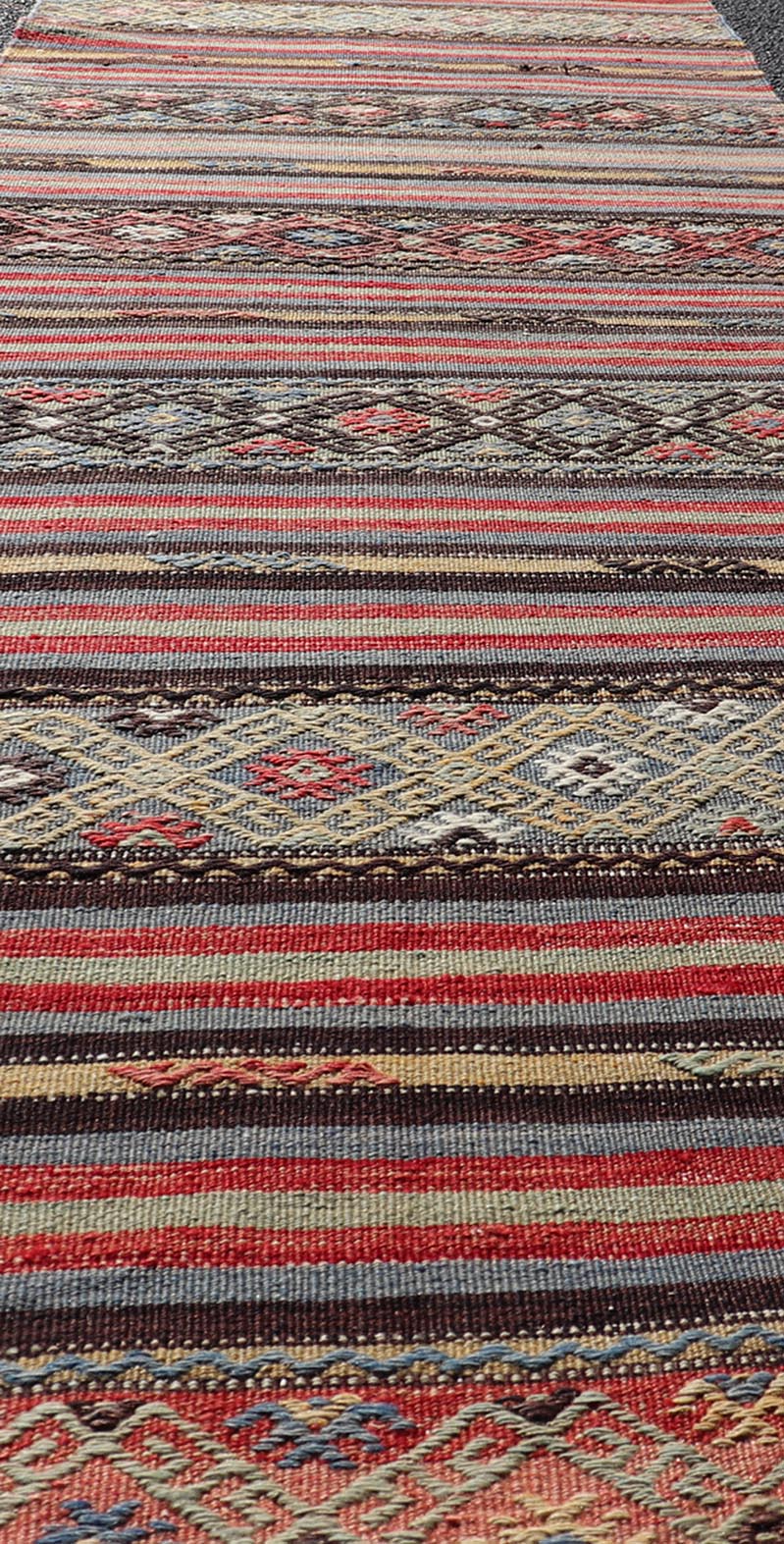 Vintage Turkish Kilim with Horizontal Stripes and Tribal Motifs in Bright Tones. Hand Woven vintage Turkish Kilim in colors with hand woven motifs with stripes, Keivan Woven Arts / rug TU - NED - 5047, country of origin / type: Turkey / Kilim, circ... - Keivan Woven ArtsTU - NED - 5047 - 22369Rug